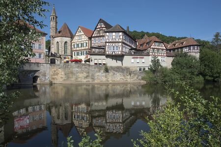 SchwÃ¤bisch Hall, Germany - July 25, 2019; City view with half timbered houses on the waterfront of a touristic town on the romantic road in Bavariaのeditorial素材