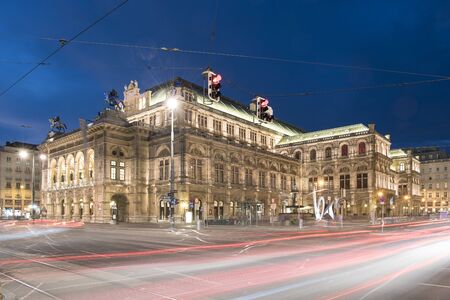 Center of Vienna with the Wiener Staatoper in the dark with light trails