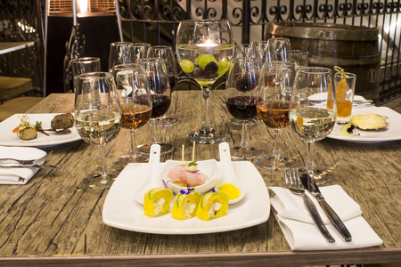 Served for a banquet table. Wine glasses with napkins, glasses and gourmet food. Picture taken in Peru.の写真素材