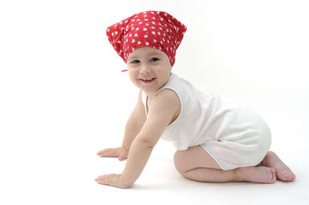 Baby with red scarf smiling on cameraの写真素材