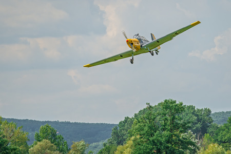 TEKOV, SLOVAKIA - JULY 26,2014: Historic german bomber Zlin 205 approaching the battlefield during reenactment of World War II fightsのeditorial素材