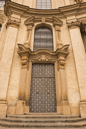 PRAGUE, CZECH REPUBLIC - AUGUST 13, 2014: Entrance door of the Baroque St. Nicholas Church on Lesser Town in Pragueのeditorial素材