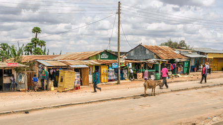 NAMANGA, KENYA - OCTOBER 20, 2014 : Shopping street in Namanga. Namanga is a town lying on the border between Kenya and Tanzania in Kajiado District, Rift Valley Province.のeditorial素材