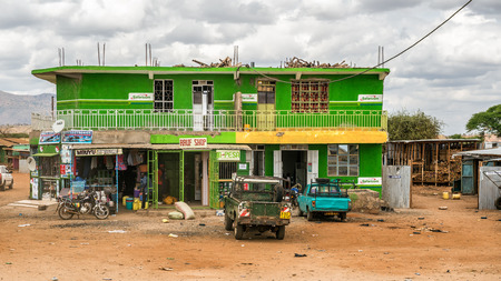 NAMANGA, KENYA - OCTOBER 20, 2014 : Shopping street in Namanga. Namanga is a town lying on the border between Kenya and Tanzania in Kajiado District, Rift Valley Province.のeditorial素材
