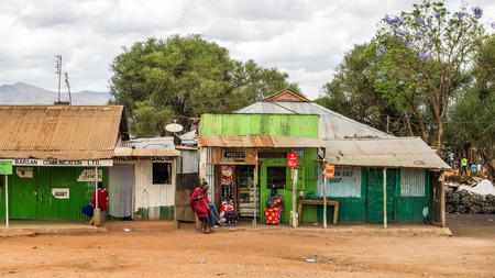NAMANGA, KENYA - OCTOBER 20, 2014 : Typical street scene in Namanga. Namanga is a town lying on the border between Kenya and Tanzania in Kajiado District, Rift Valley Province.のeditorial素材