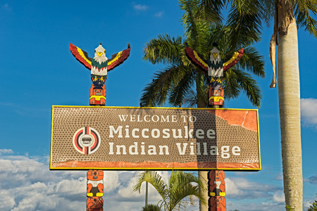 MIAMI, FLORIDA - JANUARY 13, 2015 : Entrance sign in the Miccosukee Indian Village. The Miccosukee Tribe is a federally recognized Indian Tribe residing in the Florida Everglades west of Miami.のeditorial素材