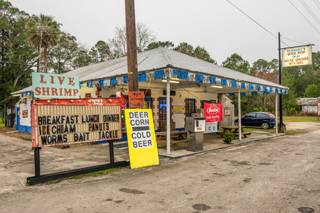 OTTER CREEK, FLORIDA - JANUARY 15, 2015 : Vintage gas pump and a general store on US Highway 19, near Cedar Key, Floridaのeditorial素材