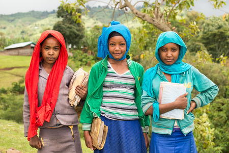 ADDIS ABABA, ETHIOPIA - MAY 4, 2015 : Young ethiopian schoolgirls holding their exercise books.のeditorial素材