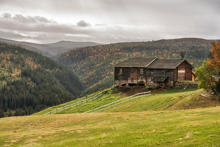 Typical norwegian farmhouse shed in autumn near Rondane National Park, Norwayの写真素材