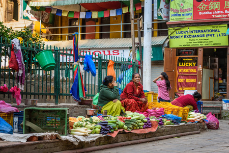THAMEL, KATHMANDU, NEPAL - OCTOBER 18, 2015 : Nepalese women selling vegetables at a small local market in Kathmanduのeditorial素材