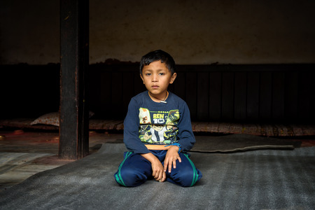 KATHMANDU, NEPAL - OCTOBER 19, 2015 : Young boy becomes a novice  at a buddhist temple in Kathmandu, Nepalのeditorial素材