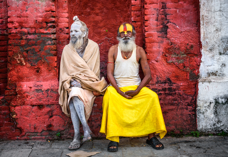 KATHMANDU, NEPAL - OCTOBER 21, 2015 : Wandering  Shaiva sadhus (holy men) with traditional face paintings in ancient Pashupatinath Templeのeditorial素材