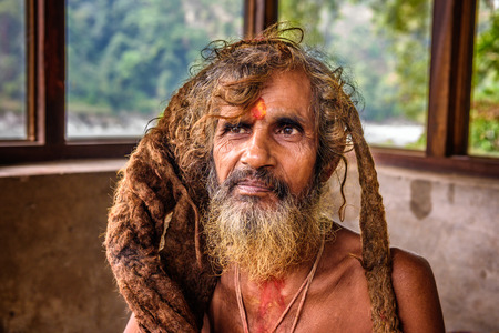 KATHMANDU, NEPAL - OCTOBER 23, 2015 : Portrait of a Sadhu baba  (holy man) with traditional long...