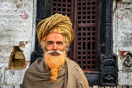 KATHMANDU, NEPAL - OCTOBER 21, 2015 : Wandering  sadhu baba (holy man) with traditional long hair in ancient Pashupatinath Templeのeditorial素材
