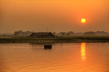 Sunset over the Taungthaman Lake near Mandalay in Myanmarの写真素材