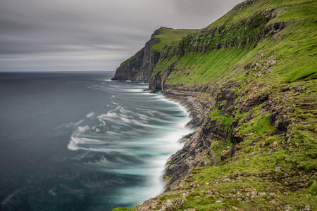 Giant sea cliffs shortly after storm on Faroe Islands. Long exposure.の写真素材