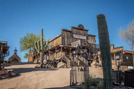 GOLDFIELD, ARIZONA, USA - MAY 17, 2016 : Old saloon and wooden church in Goldfield Ghost town. Goldfield, later Youngsberg was a gold mining town, now a ghost town in Pinal County, Arizona.のeditorial素材