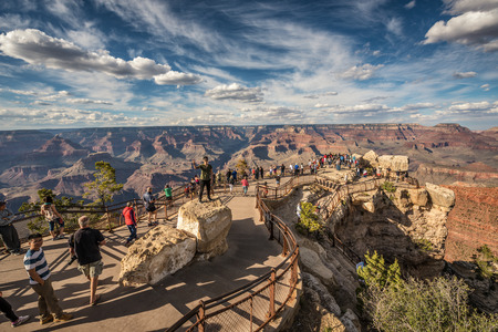 GRAND CANYON, ARIZONA, USA - MAY 16, 2016: Tourists looking at south rim of Grand Canyon from point of view named "Mather Point".のeditorial素材
