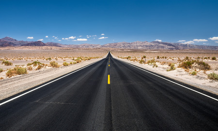 Long empty road running through Panamint Valley in Death Valley National Park, California