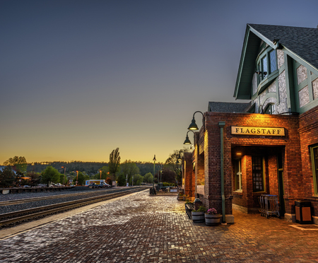 FLAGSTAFF, ARIZONA, USA - MAY 16, 2016 : Historic train station in Flagstaff at sunset. It is located on Route 66 and is formerly known as Atchison, Topeka and Santa Fe Railway depot. Hdr processed.のeditorial素材
