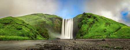 Panorama of the famous Skogafoss waterfall in southern Iceland. Long exposure.の写真素材