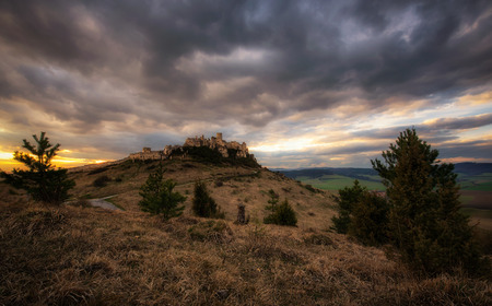 Dramatic sunset over the ruins of Spis Castle in Slovakia.  Spis Castle is a national monument and one of the biggest European castles by area.の写真素材