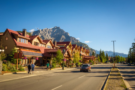 BANFF, ALBERTA, CANADA - JUNE 27, 2017 : Scenic street view of the Banff Avenue in a sunny summer day. Banff is a resort town and popular tourist destination.のeditorial素材