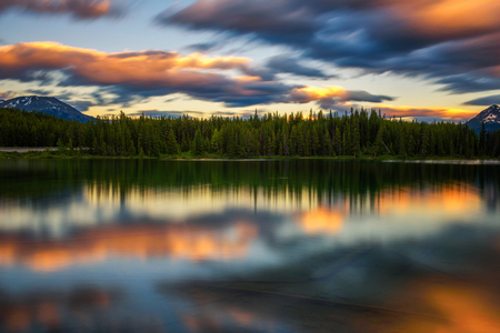 Scenic sunset over Herbert Lake along the roadside of the Icefields Parkway in Banff National Park, Alberta, Canada. Long exposure.の写真素材