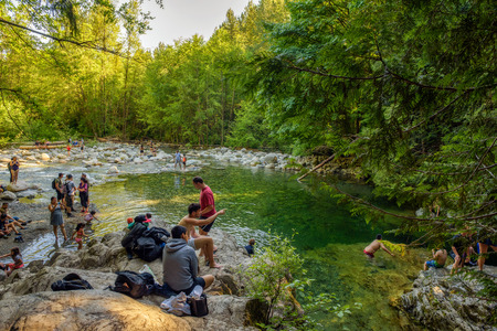 LYNN CANYON PARK, CANADA - JULY 3, 2017 : People visiting the 30 Foot Pool in Lynn Canyon Park in North Vancouver.のeditorial素材