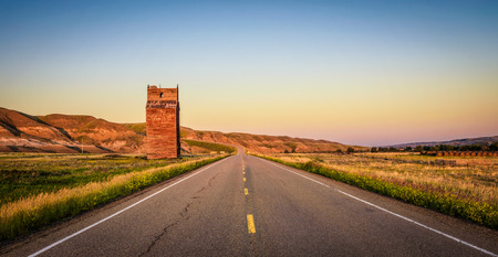 DOROTHY, ALBERTA, CANADA - JULY 6, 2017 : Abandoned grain elevator in the ghost town of Dorothy in Canada at sunset.のeditorial素材