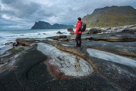 Hiker at Uttakleiv beach on Lofoten islandの写真素材