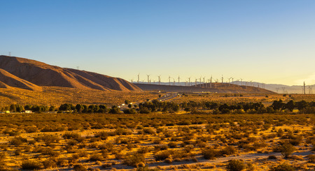 Windmills along a highway in Mojave desert, Californiaの写真素材