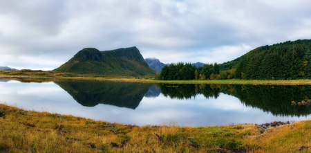 Lake with a mountain reflection on Lofoten islands in Norwayの写真素材