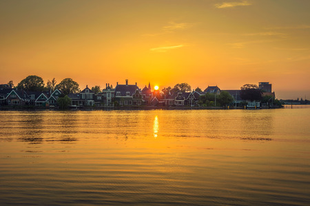 Sunset above the beautiful village of Zaanse Schans in Hollandの写真素材
