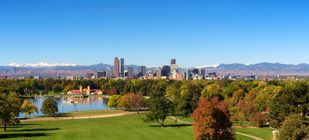 Skyline of Denver downtown with Rocky Mountainsの写真素材