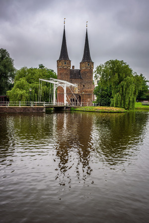 Eastern gate, canal and historic drawbridge in Delft, Netherlandの写真素材
