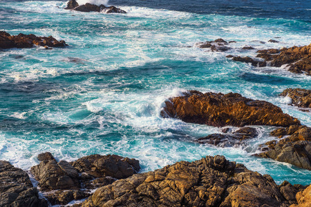 Foamy turquoise waters of Pacific oceanの写真素材