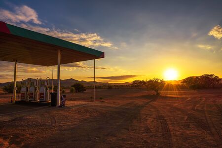 Puma gas station located on a dirt road in the Namib Desert at sunrise