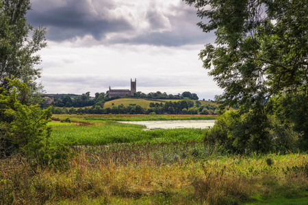 Quoile River and the Mound of Down Cathedral in Downpatrick, Northern Irelandの写真素材