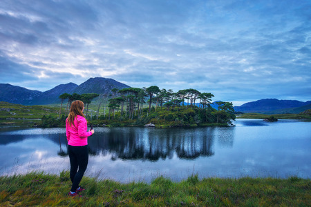 Young hiker at the Pine Island in Derryclare Lough