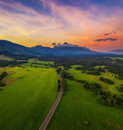 Country road to the High Tatra Mountains at sunset in Slovakiaの写真素材