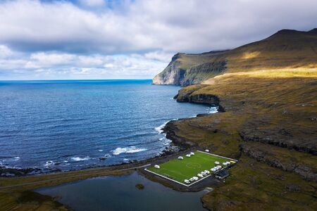Aerial view of an old football field on the coast near Eidi in Faroe Islandsの写真素材