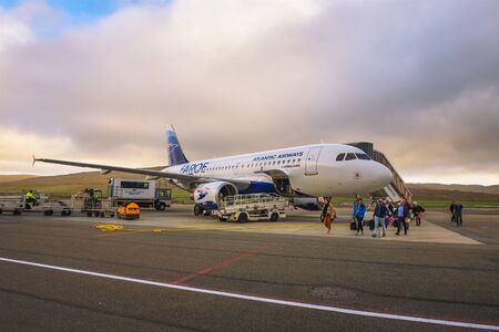 Passengers disembark from airplane at the Faroe Islands airportのeditorial素材