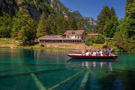 Tourists taking a boat trip on Blausee Lake in Switzerlandのeditorial素材