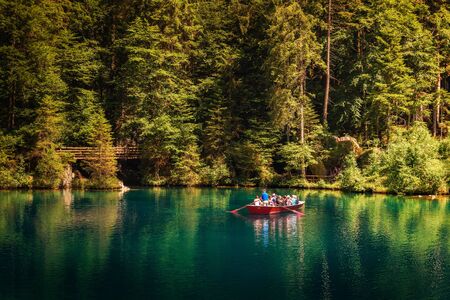 Tourists taking a boat trip on Blausee Lake in Switzerlandのeditorial素材