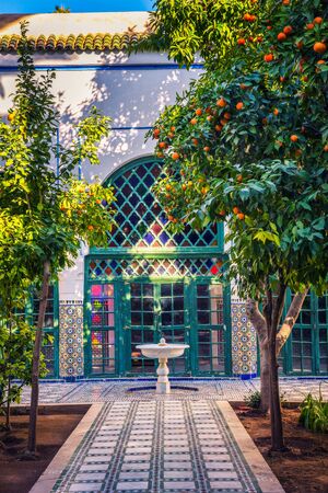 Small white fontaine among orange trees of Jardin Majorelle, Marrakech, Moroccoのeditorial素材