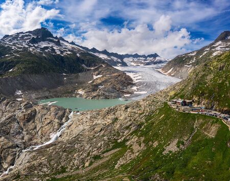 Aerial view of the melting Rhone glacier and the glacial lake in the Swiss Alpsの写真素材