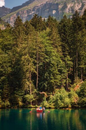 Tourists taking a boat trip on Blausee Lake in Switzerlandのeditorial素材
