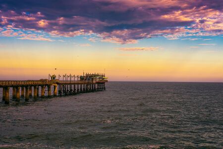 Sunset over the old historic jetty in Swakopmund, Namibiaの写真素材