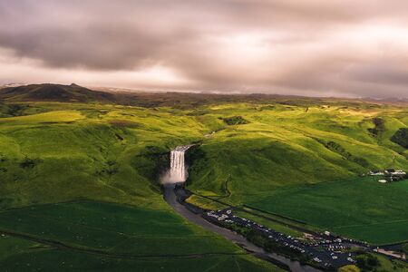 Aerial view of the Skogafoss waterfall in southern Iceland at sunsetの写真素材